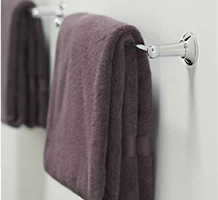 Purple towels on a towel bar